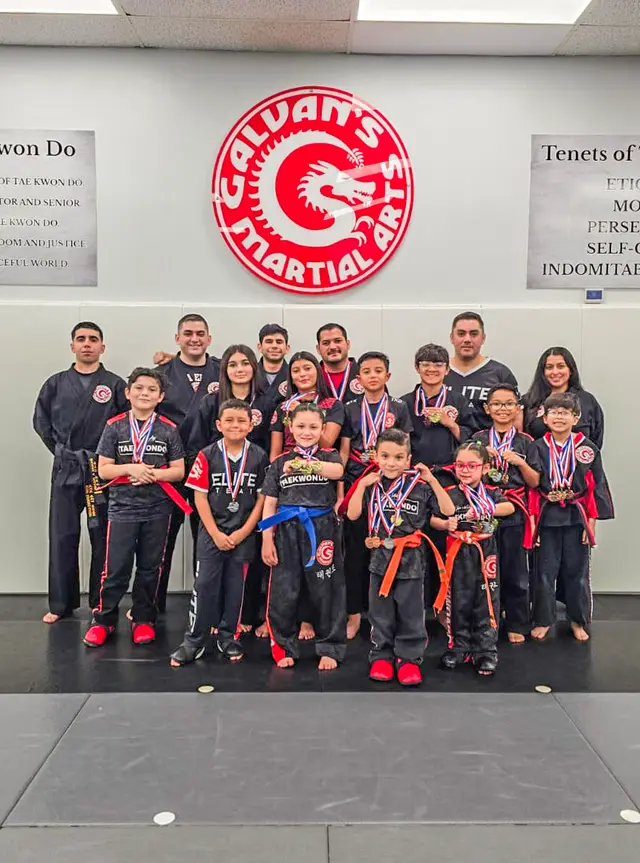Tae Kwon Do students with their medals and instructors at Galvan's Martial Arts